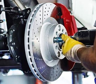 Brake caliper and disc rotor — brake repair, Guzman Auto Repair, Aurora IL